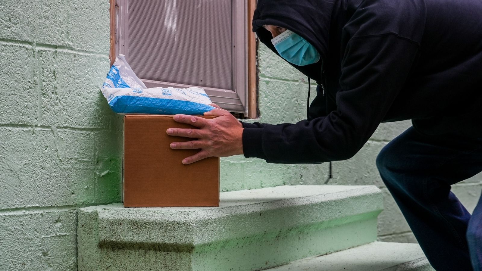 thief stealing amazon package