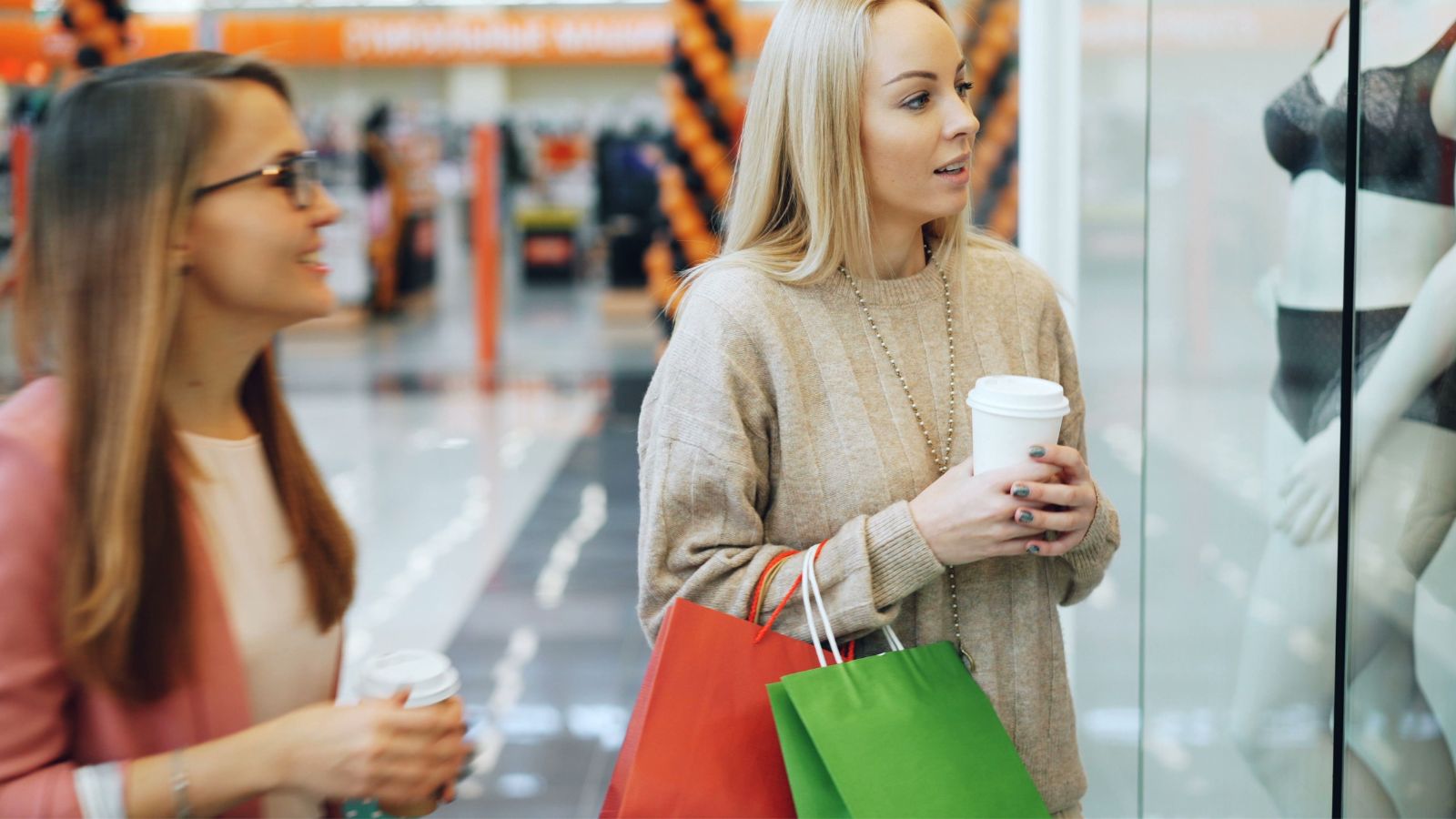 Two women shopping in a mall