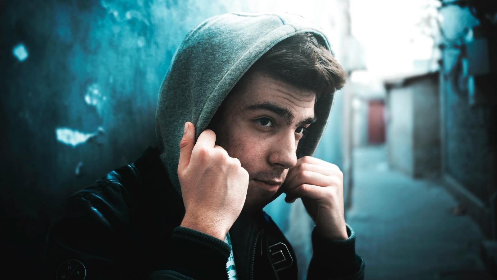 Renter Refuses to Let Neighbor Teen Inside Her Apartment—Then Watches Him Show His Chilling True Colors teenager in dark hoodie