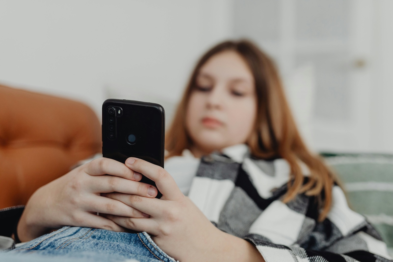 Teen texting on her phone