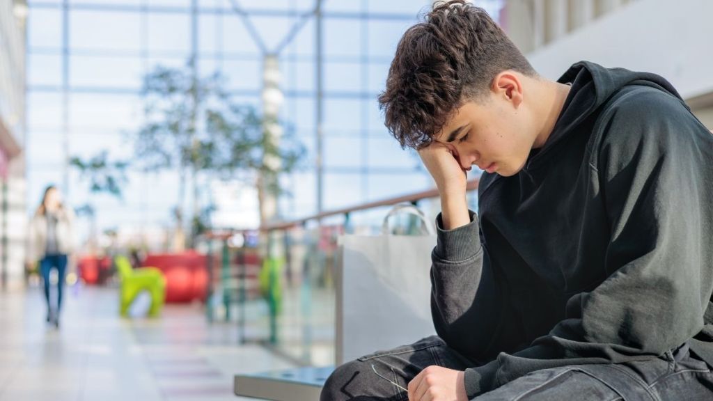 tired teen boy