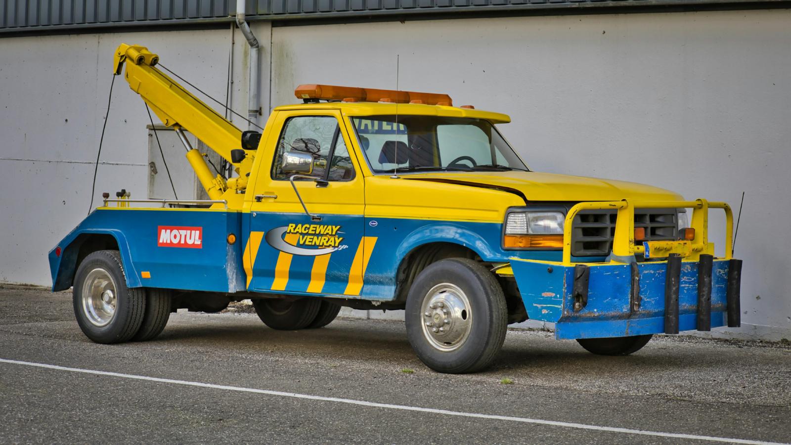 A Parking Lot Tow Situation Sparked Unexpected Tension Between Coworkers two truck on a street