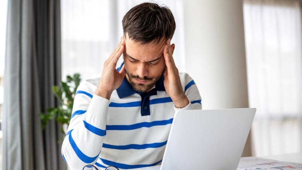 man stressed out at desk