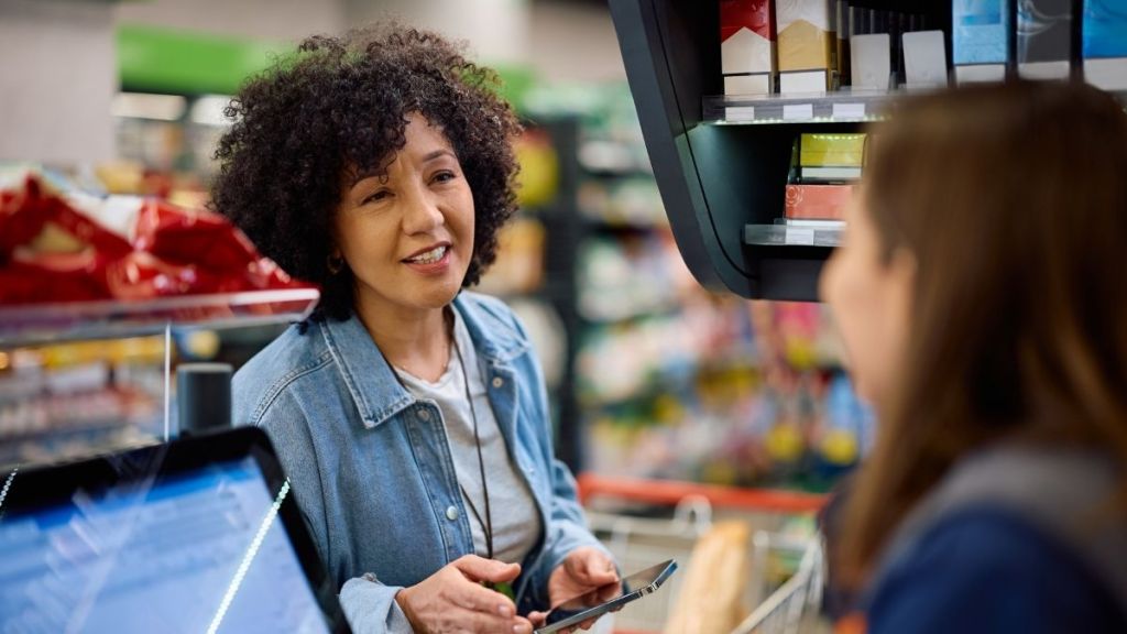 two cashiers talking