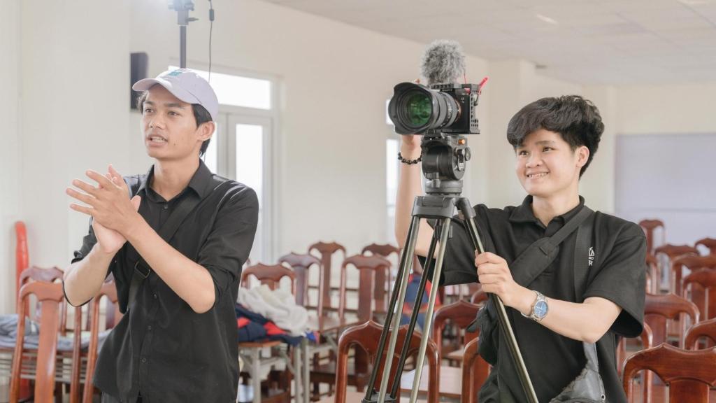 two film students operating a camera
