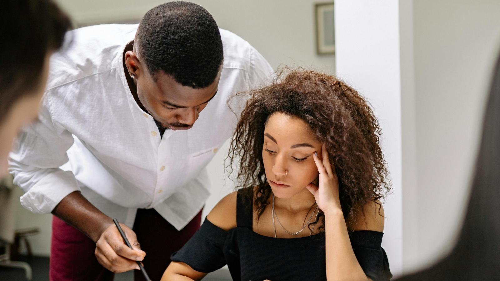 Burned Out Worker in Understaffed Job Finally Speaks Up After Being Told to “Smile” at Work unhappy female employee in office