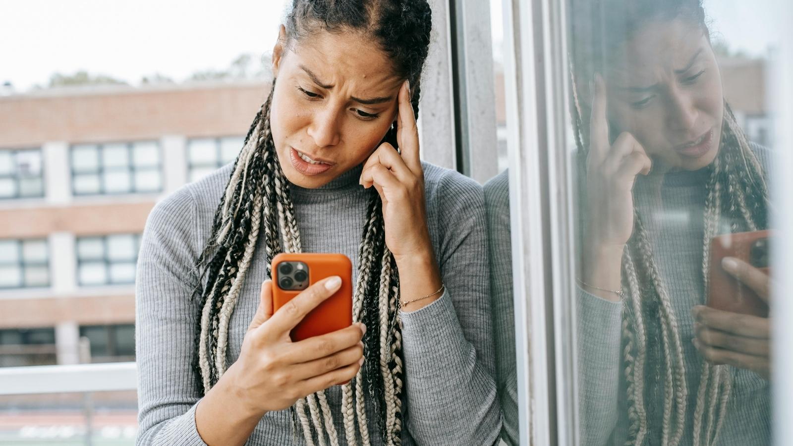 Woman Says Years of Unequal ADHD Support Led to Explosive Family Argument Over Academic Success upset woman talking on the phone