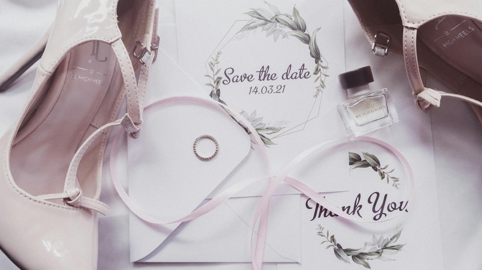 Bride Faces Absurd Group Chat Backlash for Failing to Notify an Uninvited Classmate wedding save the date/invitation with shoes and rings