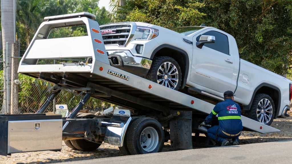 white truck being towed