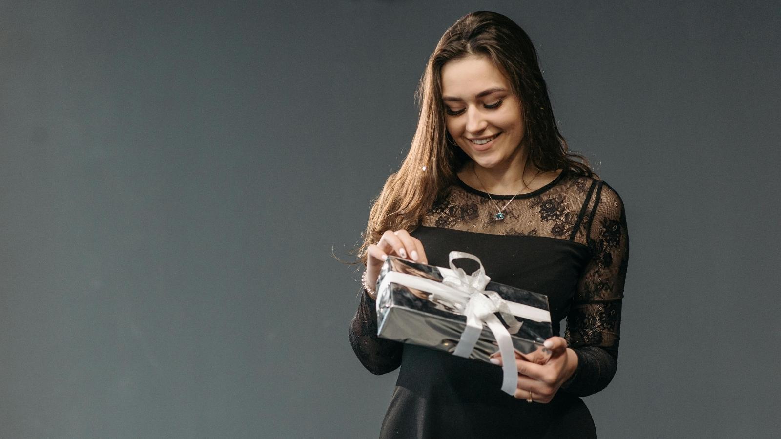woman opening a gift box