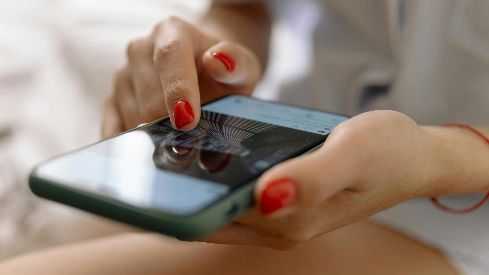 woman scrolling instagram on her phone