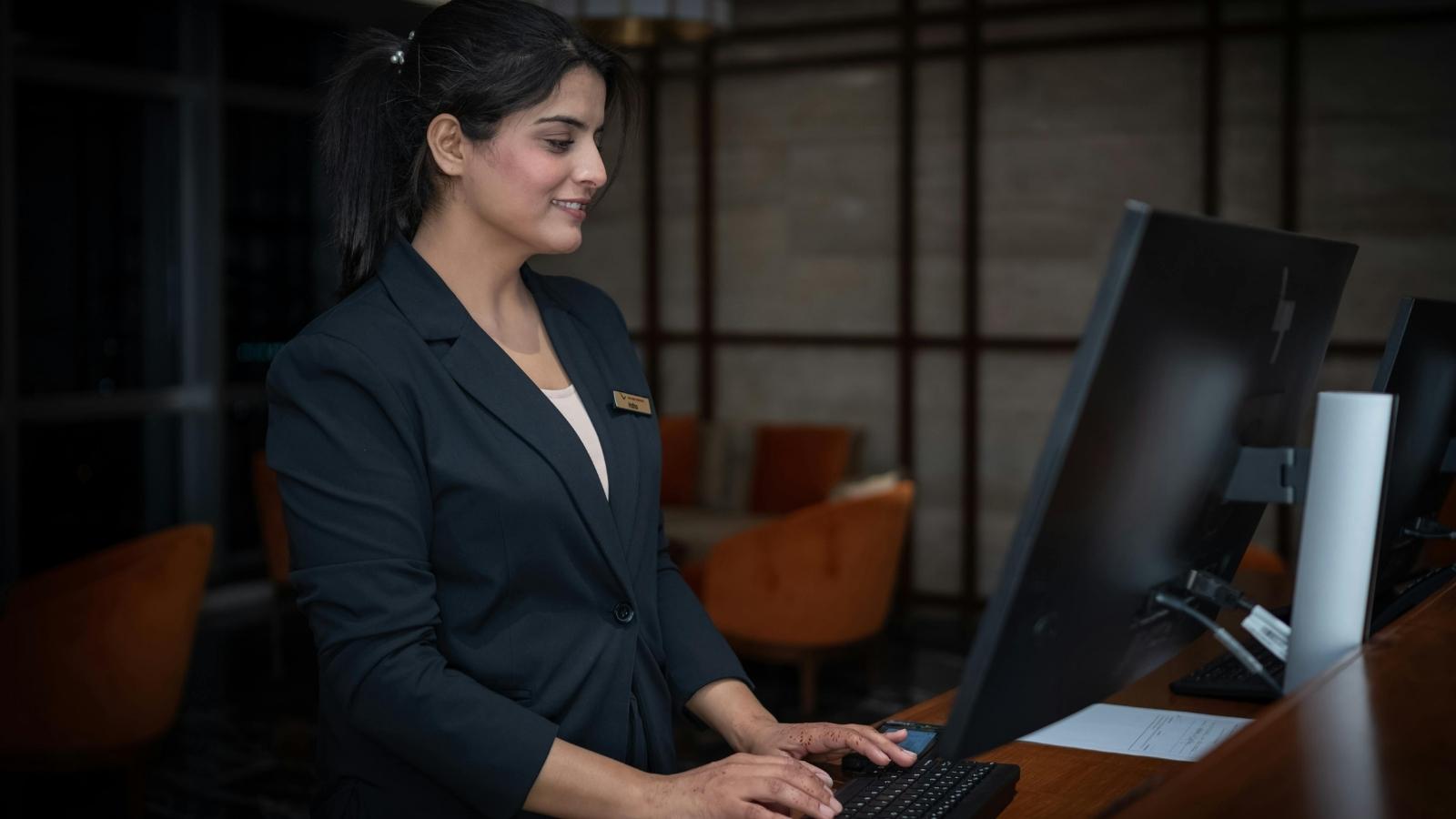 woman working at hotel front desk