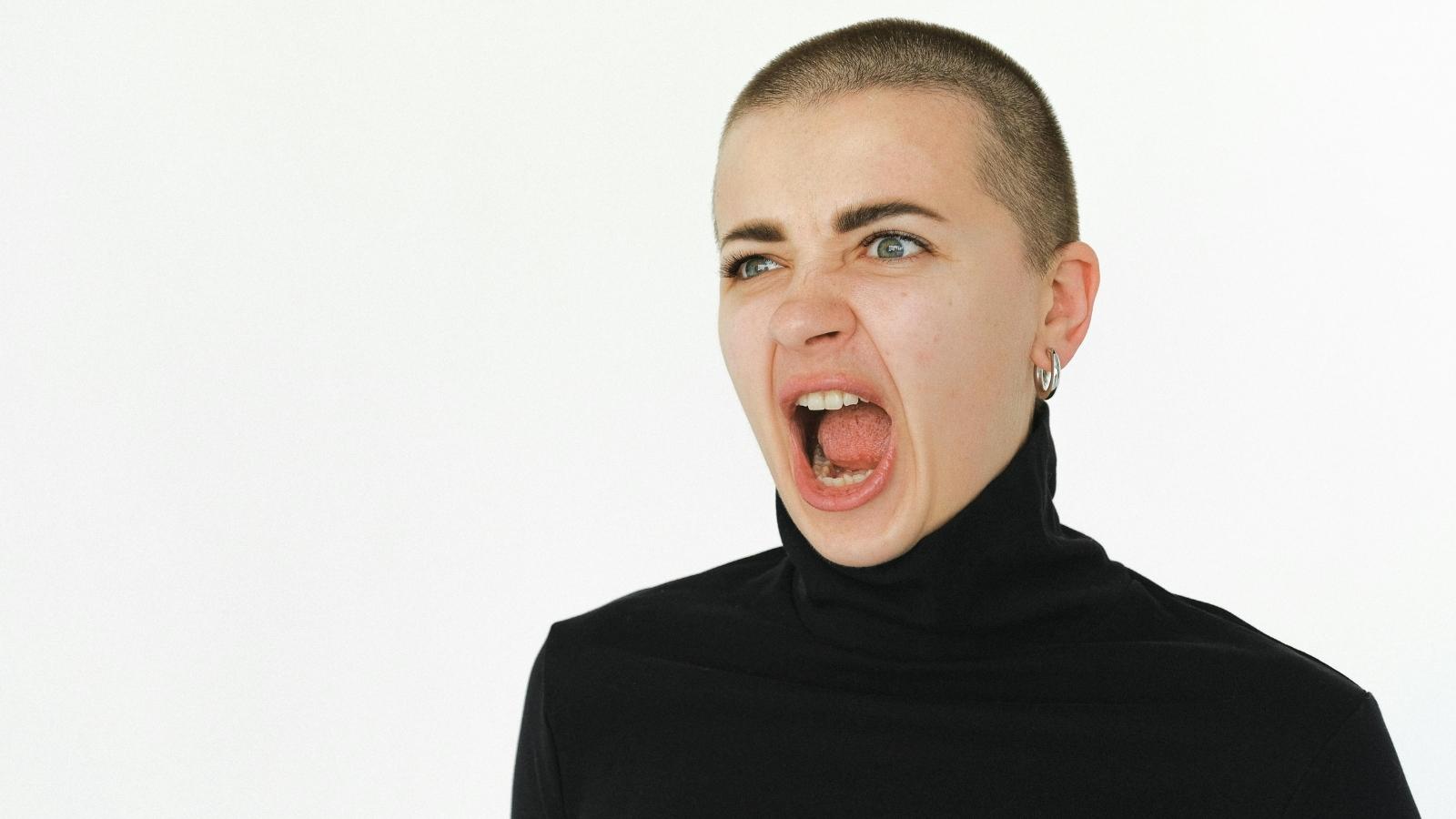 The Sanctuary Defense: Why One Clever Sister Re Engineered Her Entire House Layout to Stop Her Sibling From Moving In woman yelling in black turtleneck