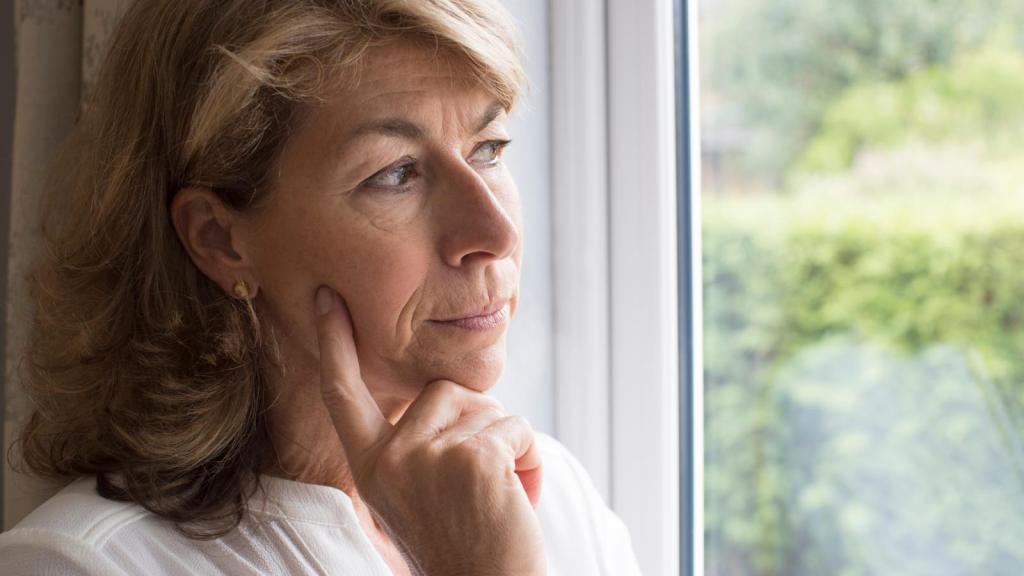 woman looking out a window