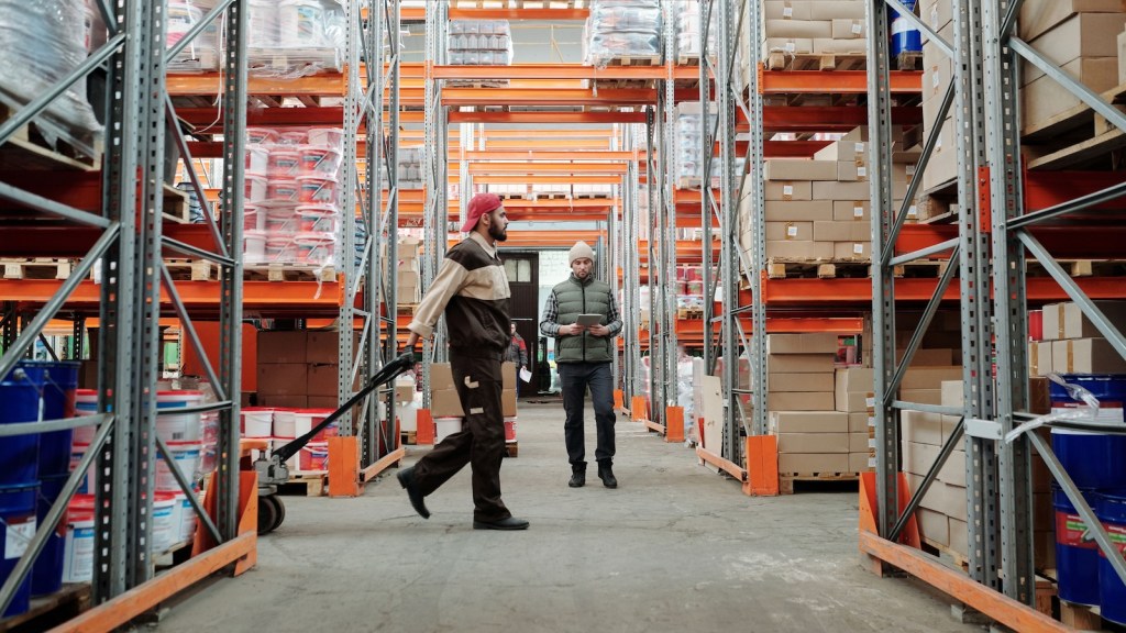 warehouse employee walking through store