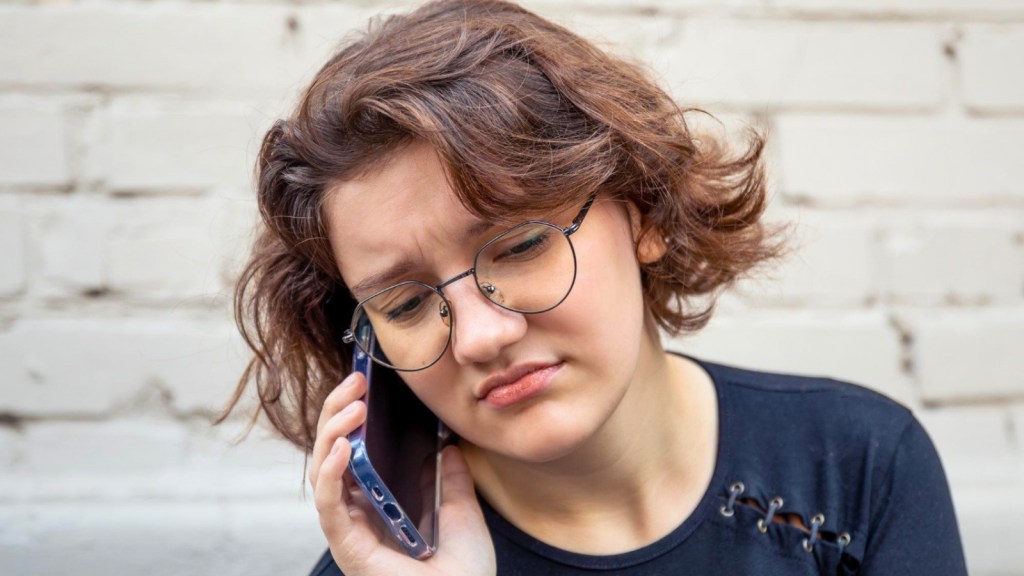 Upset woman talking on the phone