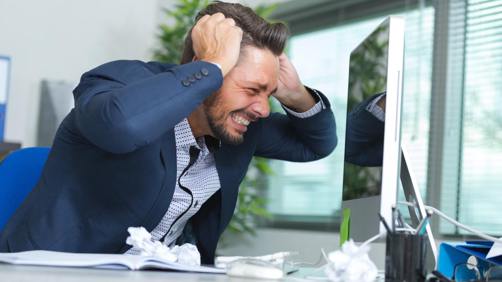 They Accepted a Salaried Position for Stability. Now the Company Is Demanding Endless Free Labor to Dodge Paying Overtime. man screaming at his computer