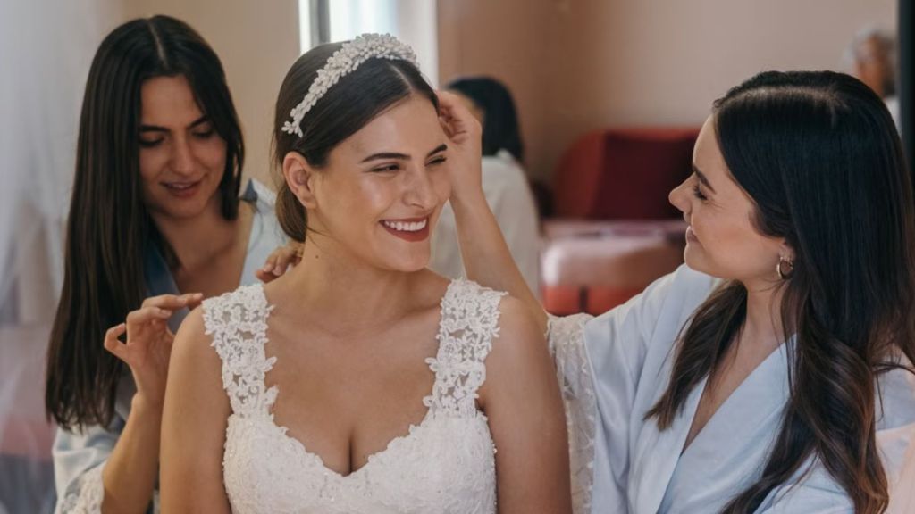 Bride and female friends getting ready for a wedding