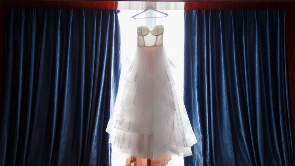 A wedding dress on a hanger