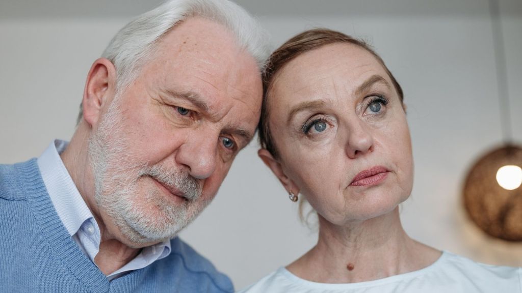 Stern middle aged couple