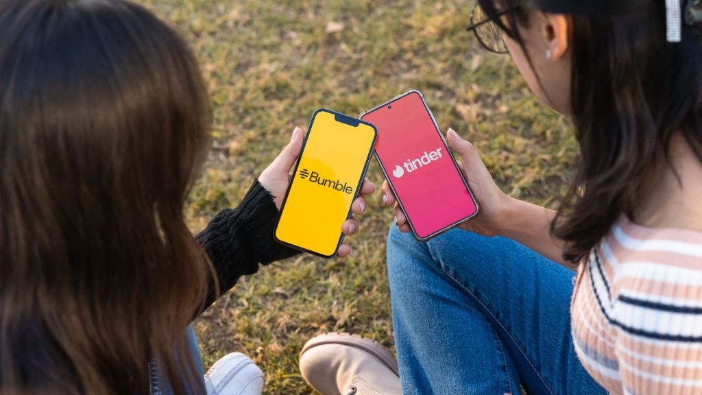 Two women using dating apps