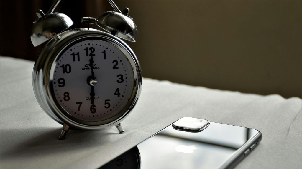 A phone and an alarm clock