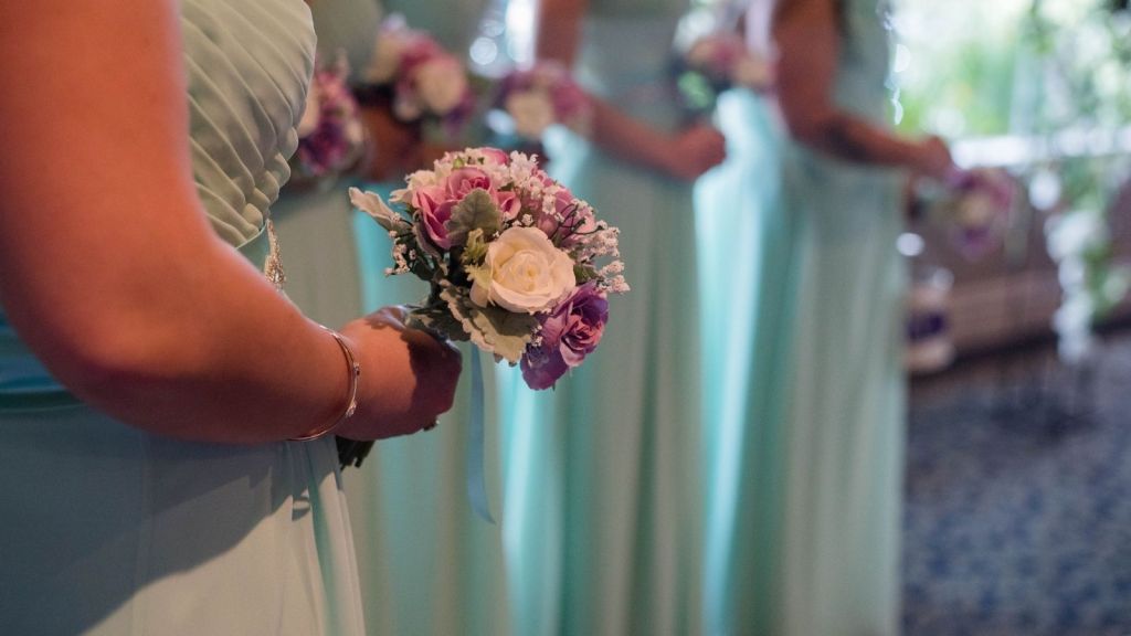 Bridesmaids holding flowers in a wedding