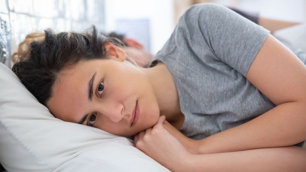 A woman lying awake