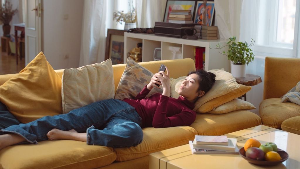A woman relaxing on the couch