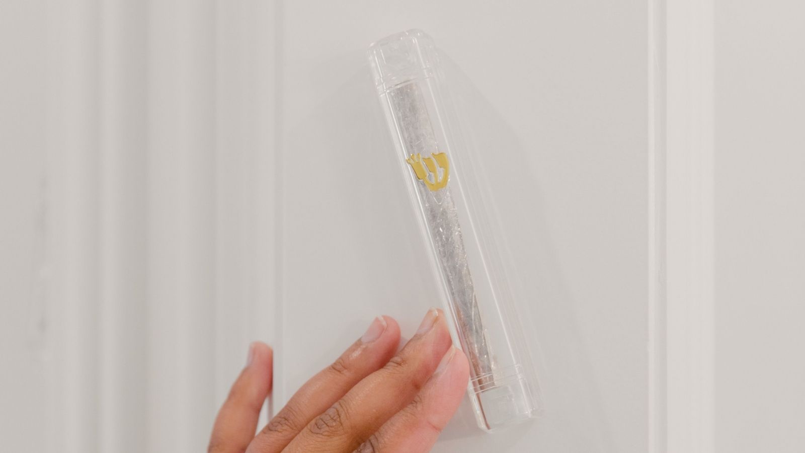 A Jewish Roommate Asked Before Hanging a Mezuzah by the Door — Her Roommates OCD Triggered an Unexpected Reaction A mezuzah mounted on a doorframe