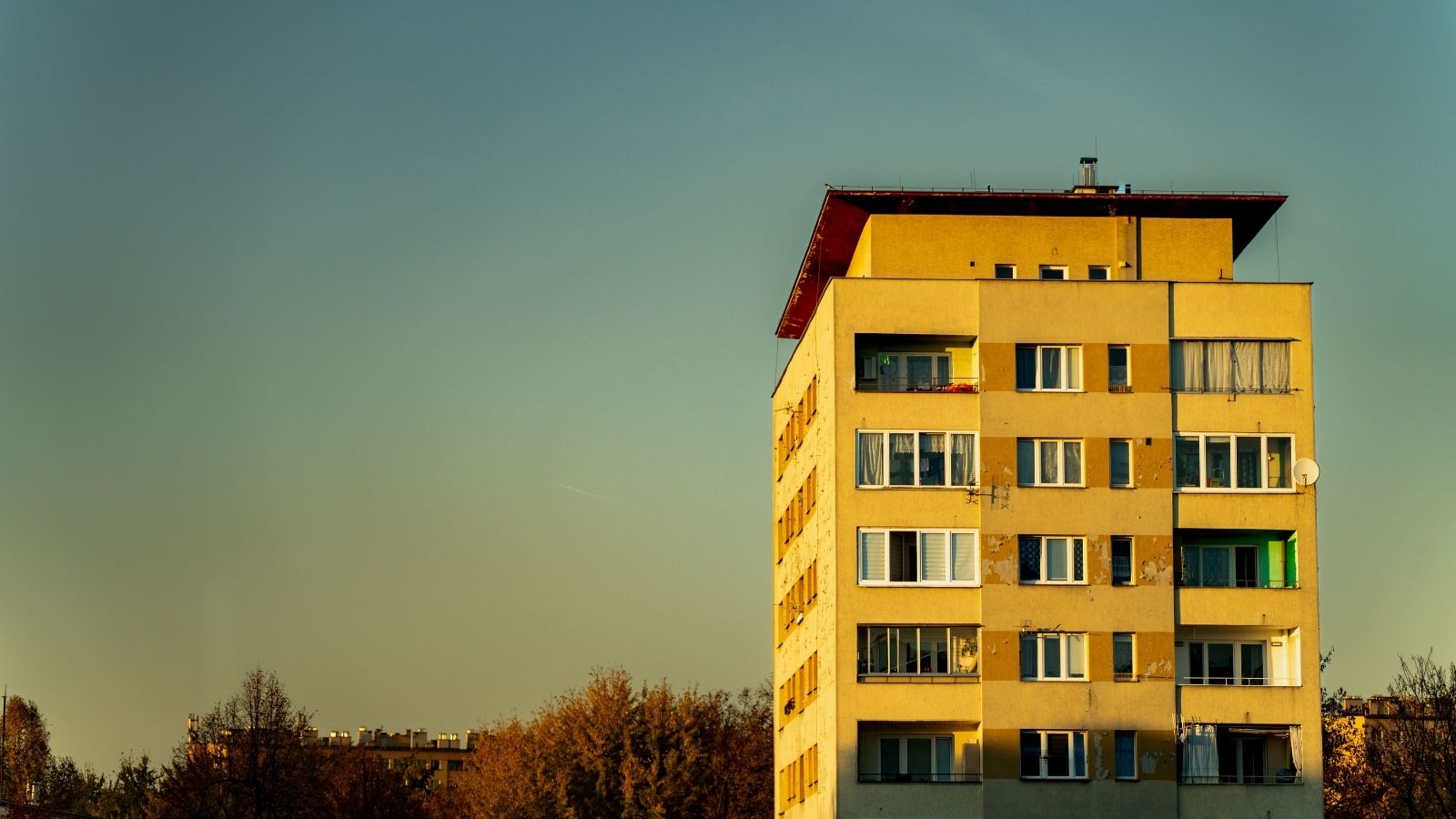 A yellow apartment block