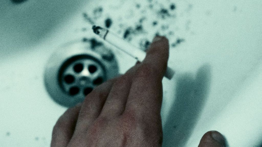 Cigarette ash in a sink
