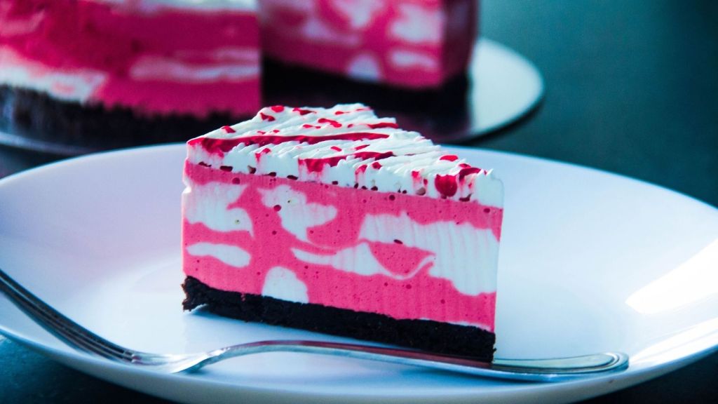 A slice of pink and white cake