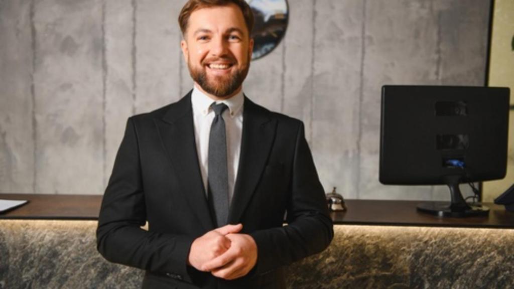 Smiling hotel manager