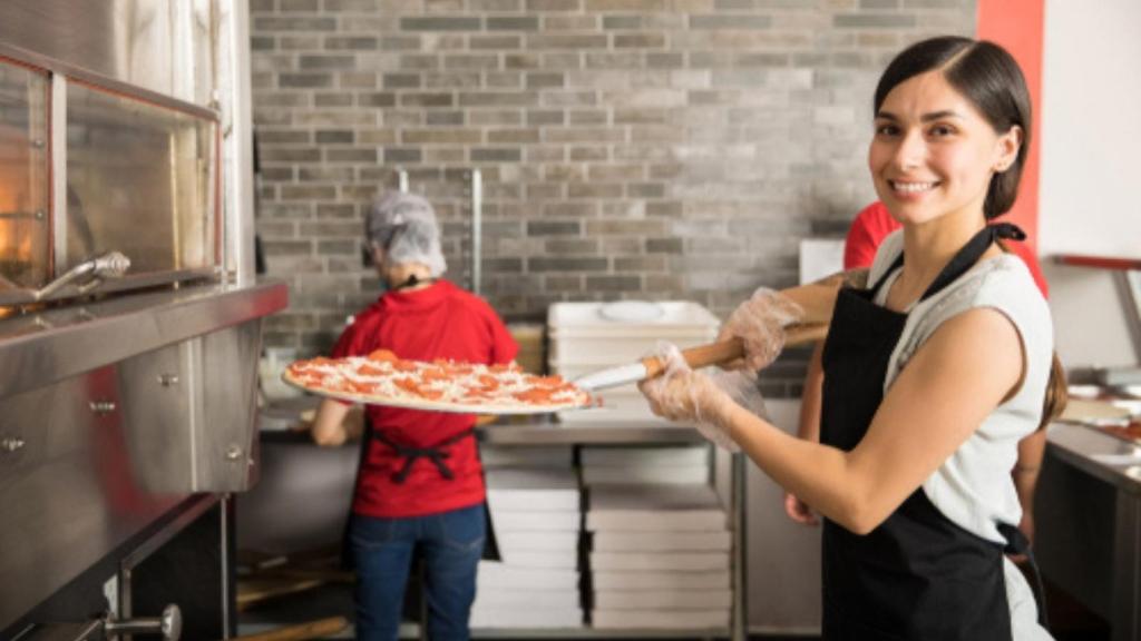Woman at pizza shop