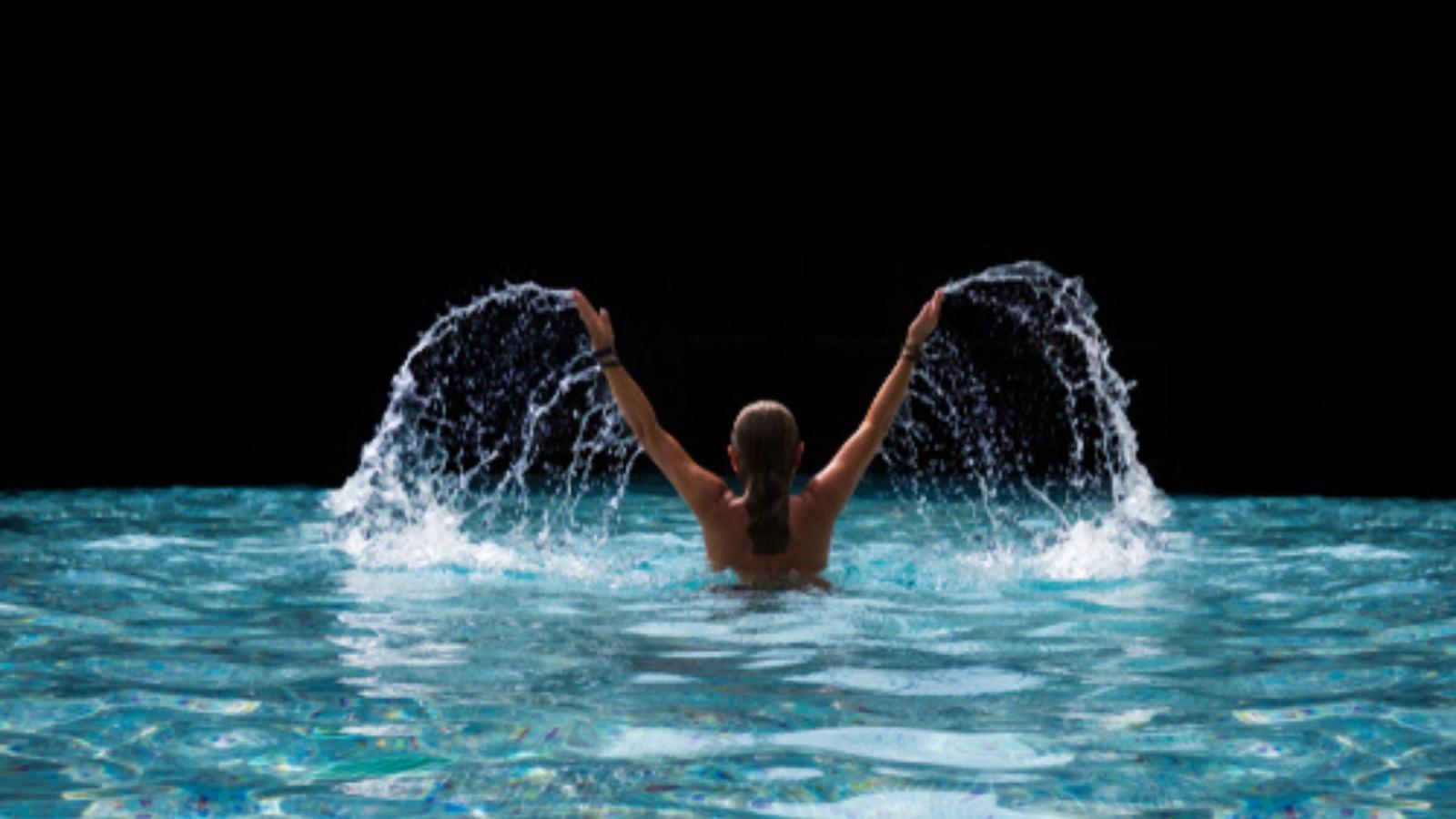 Woman swimming in pool