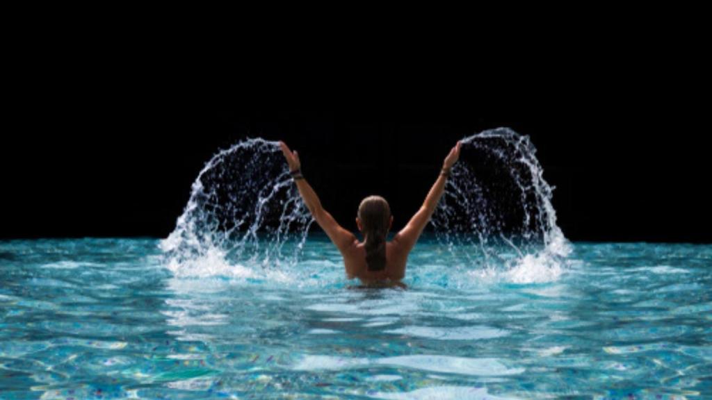 Woman swimming in pool