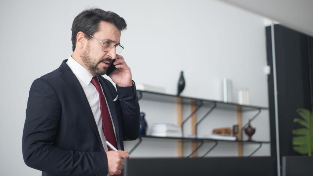 Man on the phone listening to someone complain