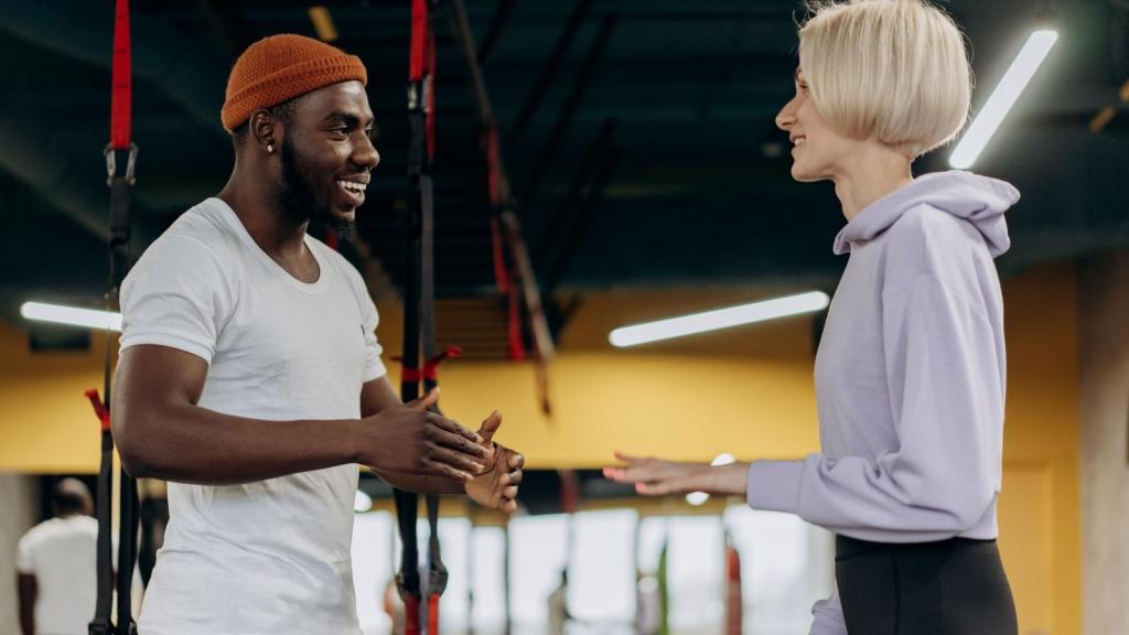 Man trying to tell a woman what's going on.