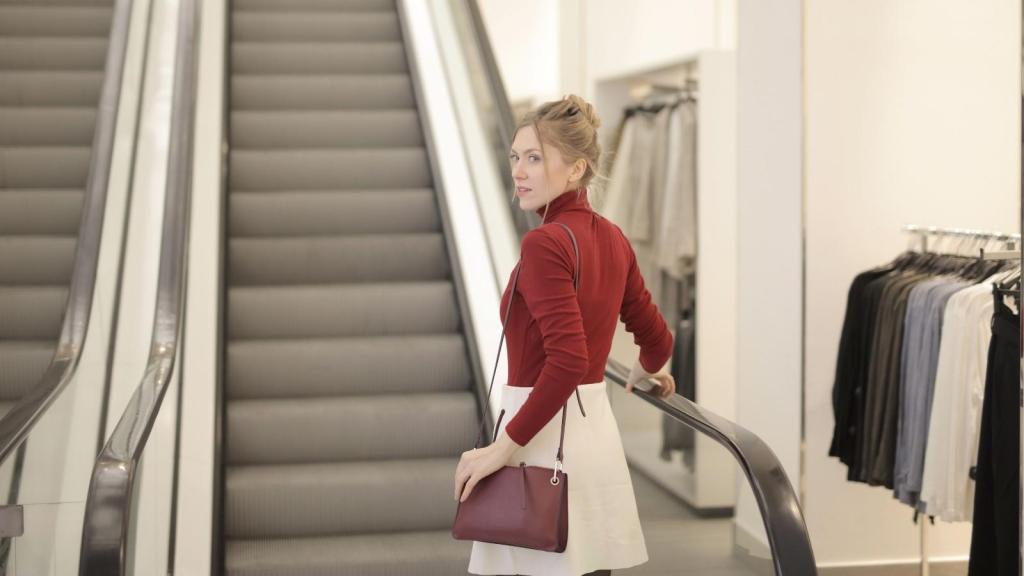 Woman riding the escalator in a large store