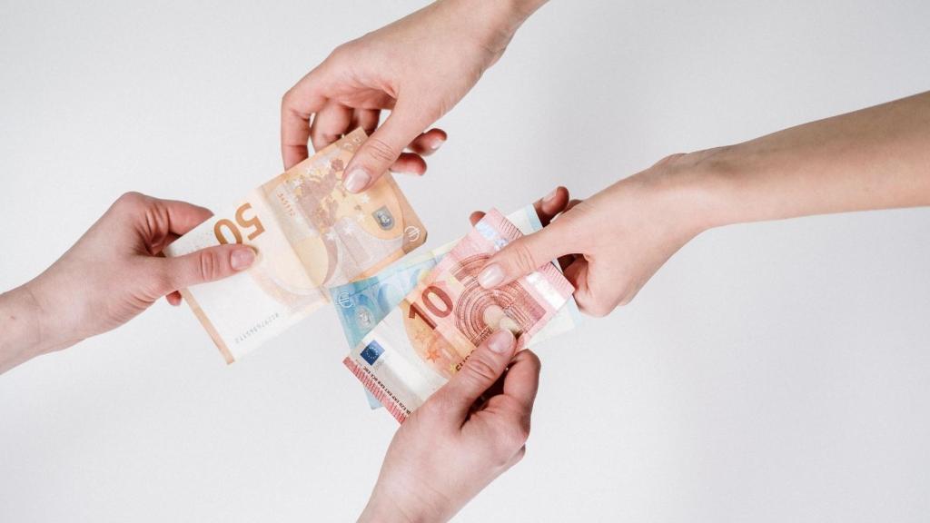 two people trading change back and forth