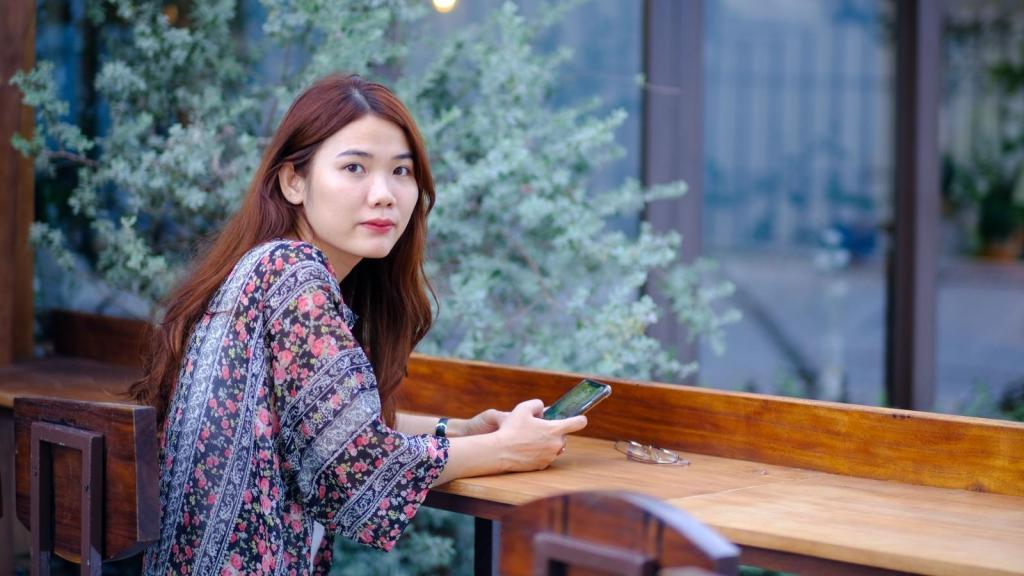 Korean woman sitting at a table.