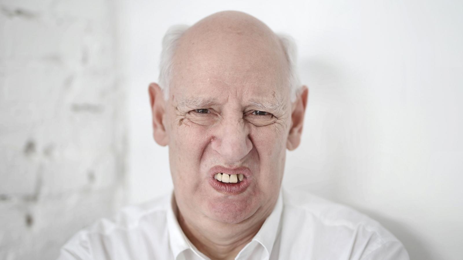 Old grouch man making a funny face