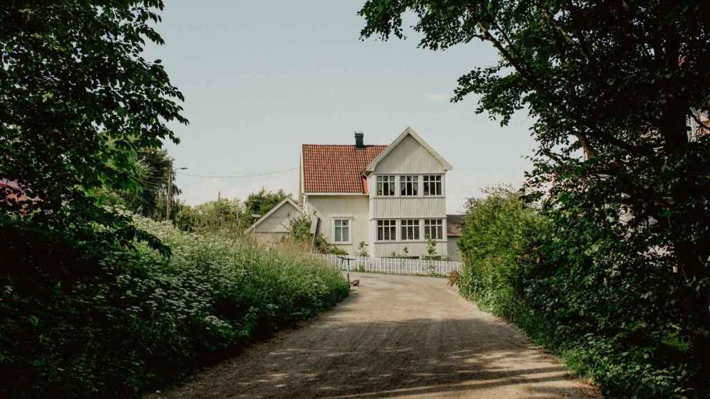 Farmhouse down a gravel road