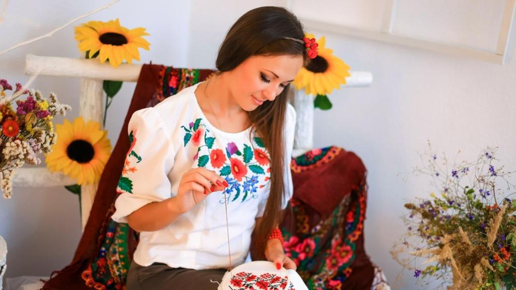 Woman having fun with an embroidery project.