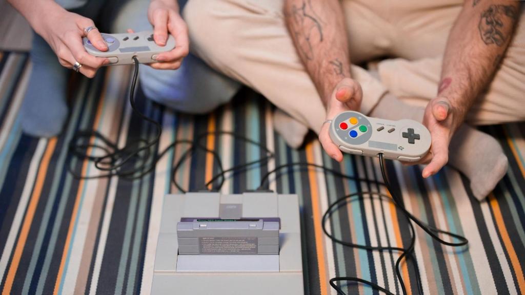 Man and son playing SNES
