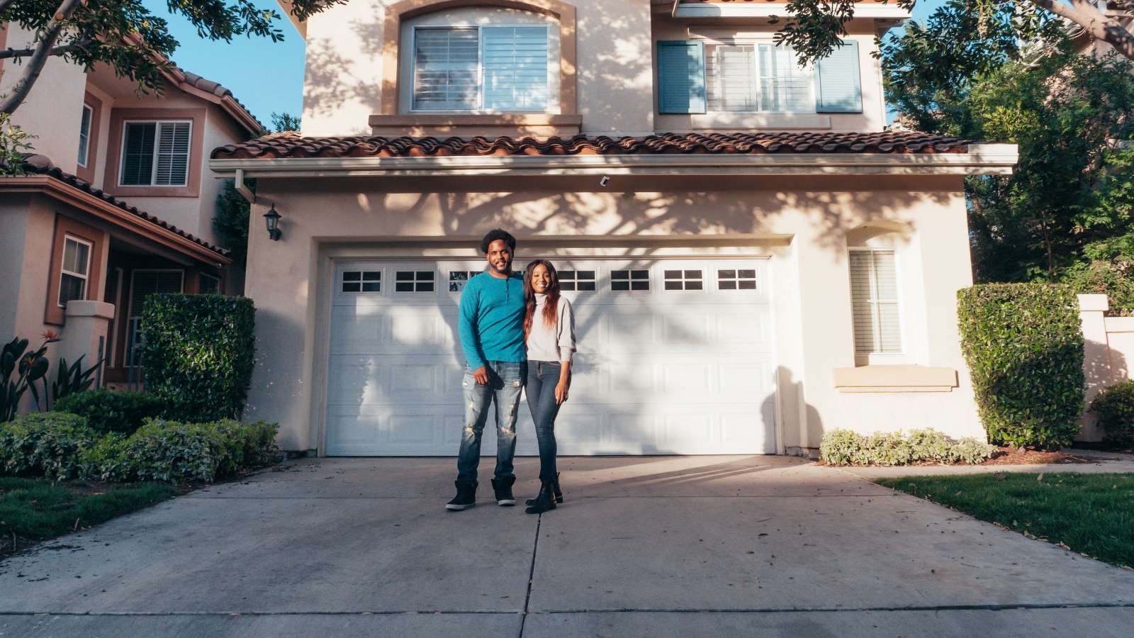 Keep Your Gift!: Homeowner Rejects Neighbors Weak Peace Offering After the Man Aggressively Yelled at His Wife for Not Waving Back Couple standing out front their home