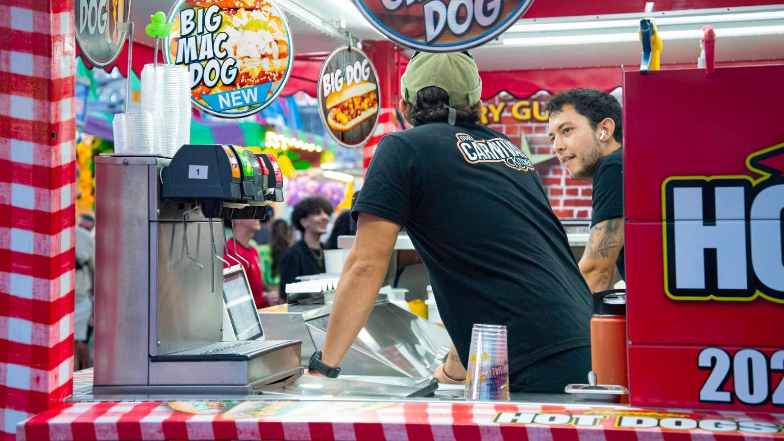 Cinema Employee Steps In to Shield Coworker After Customer Launches Wild Meltdown Over A Few Pennies Men working at a movie theater concession stand