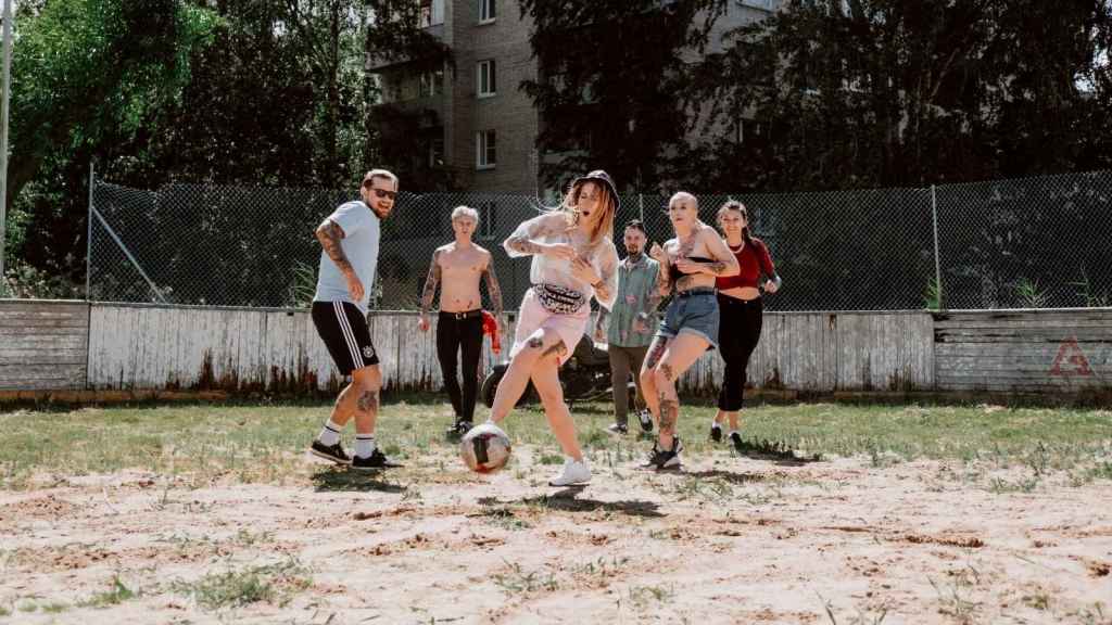 Group of adults playing ball outside