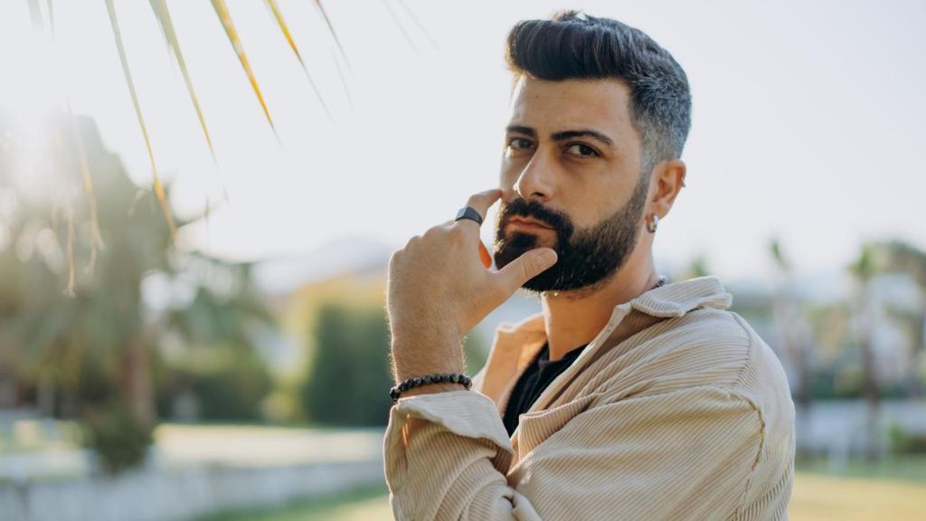 Man holding his face, thinking about what to do